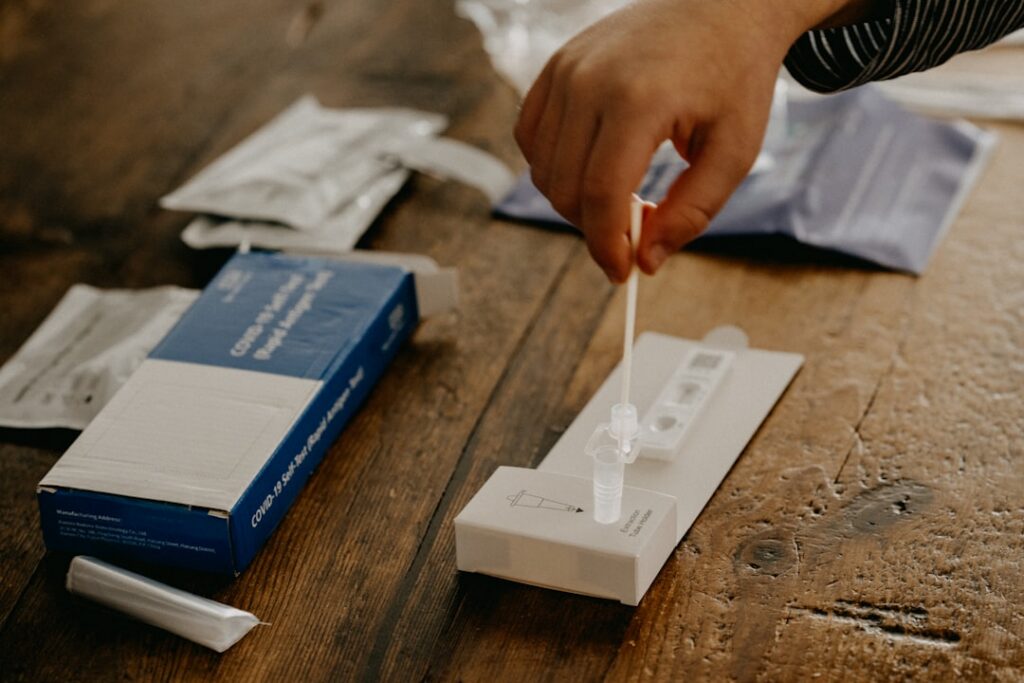 person holding DNA test kit — Vitalheros
